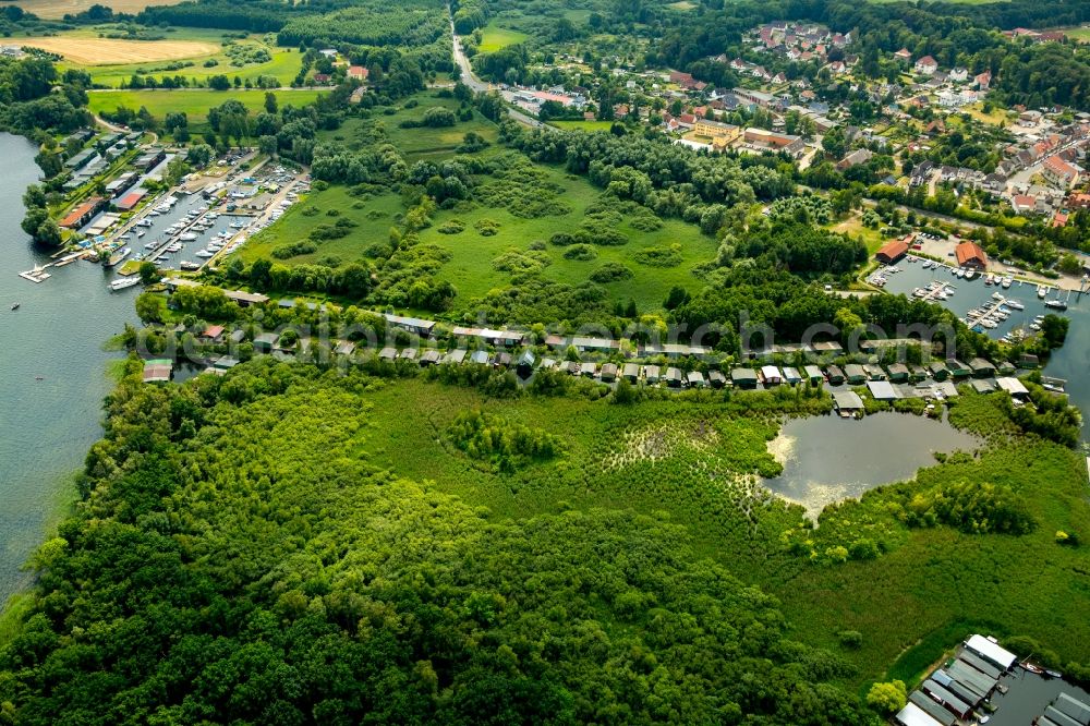 Aerial photograph Plau am See - Boat House ranks with the recreational marine jetties and boat mooring area on the banks Plauer See in Plau am See in the state Mecklenburg - Western Pomerania