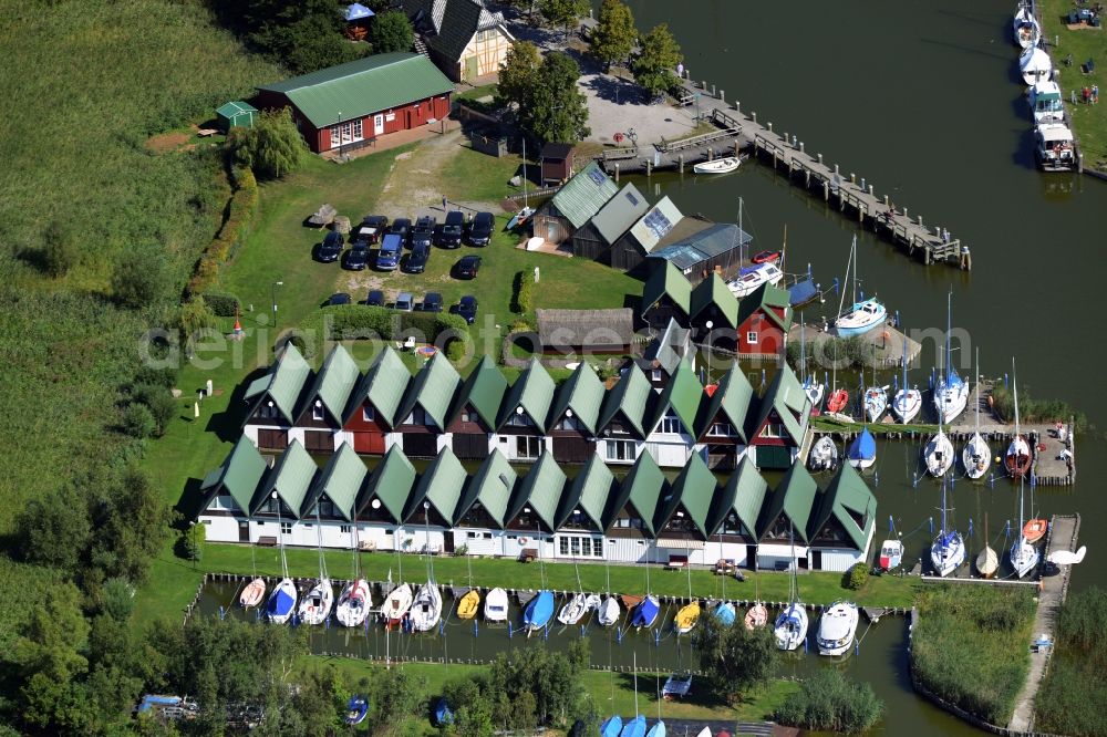 Aerial image Ahrenshoop - Boat House ranks with the recreational marine jetties and boat mooring area on the banks of see Saaler Bodden in Ahrenshoop in the state Mecklenburg - Western Pomerania