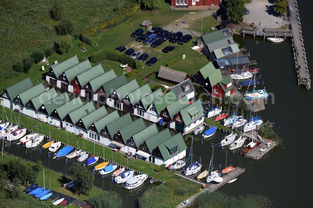 Aerial photograph Ahrenshoop - Boat House ranks with the recreational marine jetties and boat mooring area on the banks of see Saaler Bodden in Ahrenshoop in the state Mecklenburg - Western Pomerania