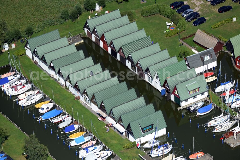 Ahrenshoop from above - Boat House ranks with the recreational marine jetties and boat mooring area on the banks of see Saaler Bodden in Ahrenshoop in the state Mecklenburg - Western Pomerania