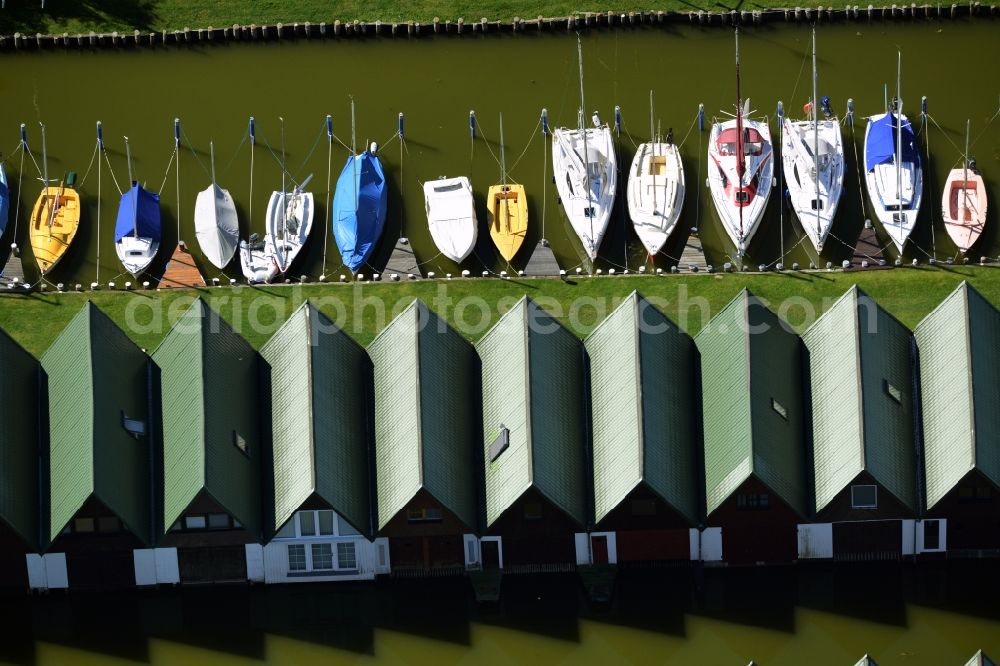 Aerial image Ahrenshoop - Boat House ranks with the recreational marine jetties and boat mooring area on the banks of see Saaler Bodden in Ahrenshoop in the state Mecklenburg - Western Pomerania