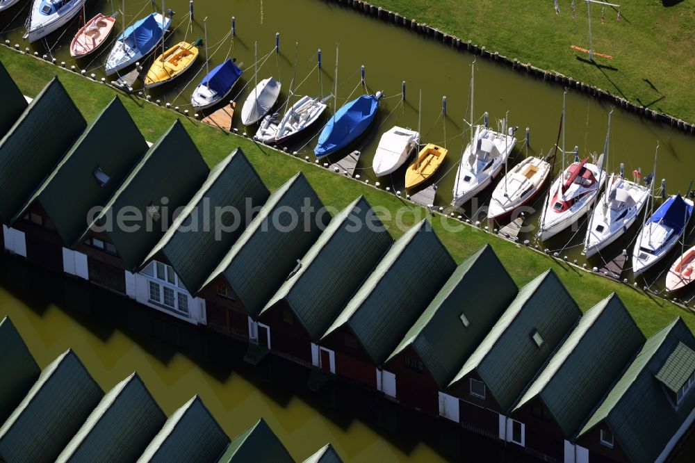 Aerial image Ahrenshoop - Boat House ranks with the recreational marine jetties and boat mooring area on the banks of see Saaler Bodden in Ahrenshoop in the state Mecklenburg - Western Pomerania