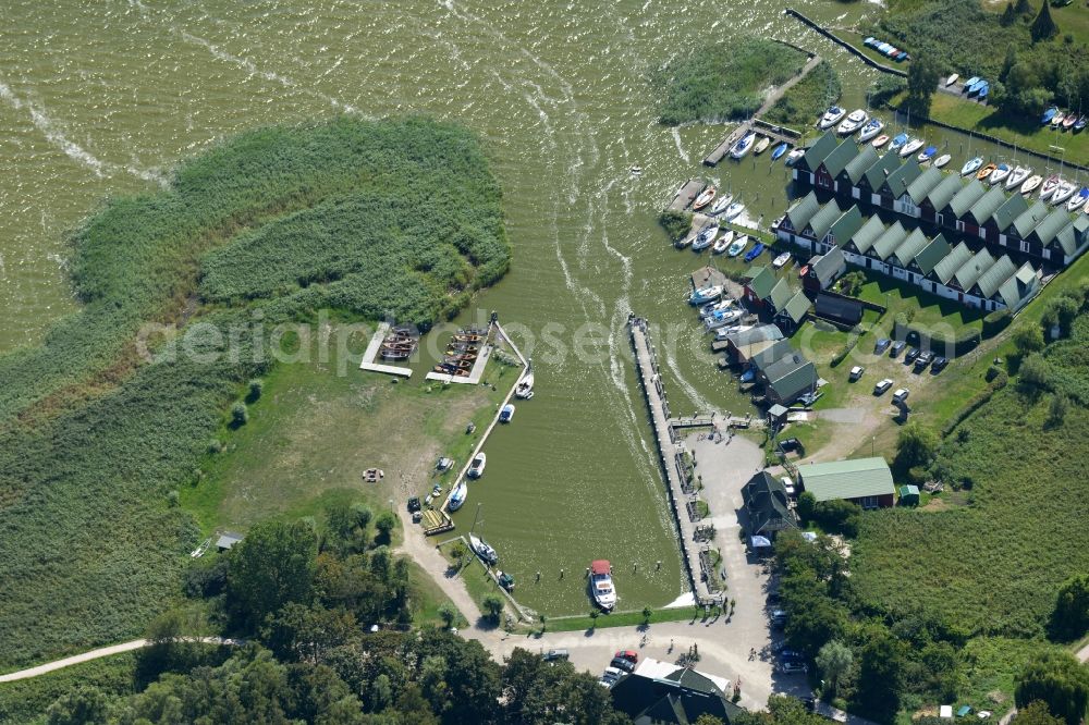 Ahrenshoop from above - Boat House ranks with the recreational marine jetties and boat mooring area on the banks of see Saaler Bodden in Ahrenshoop in the state Mecklenburg - Western Pomerania