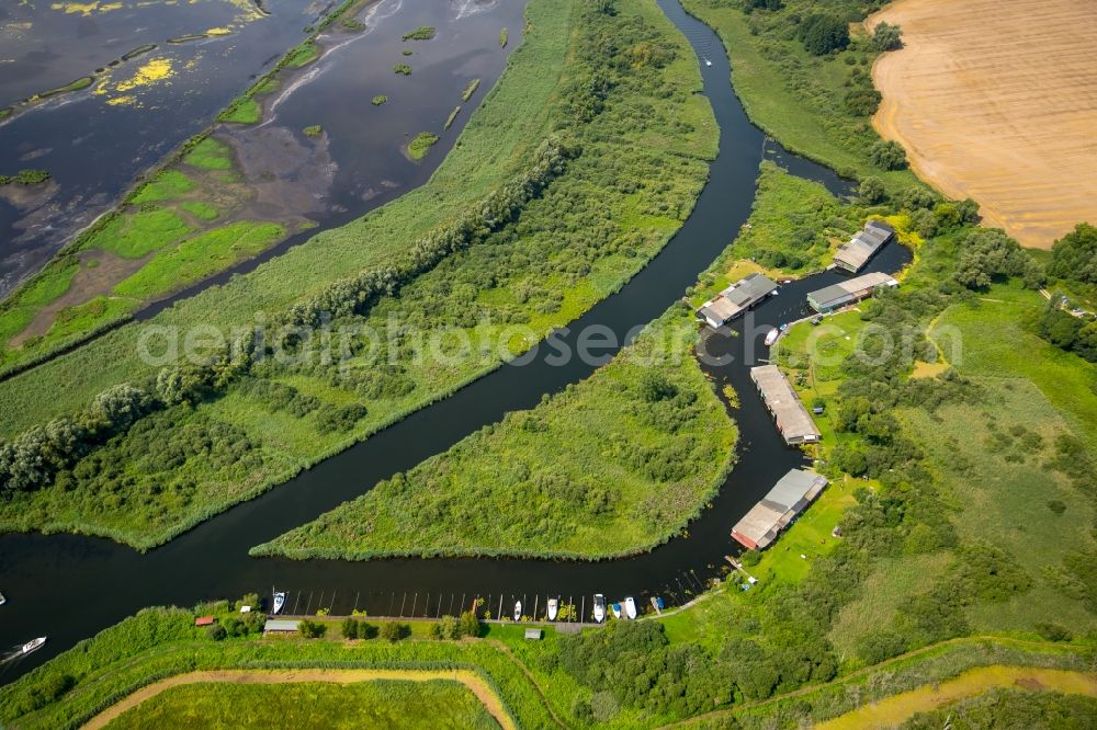 Aerial image Verchen - Boat Houses with the recreational marine jetties and boat mooring area on the banks of the river Peene in Verchen in the state Mecklenburg - Western Pomerania