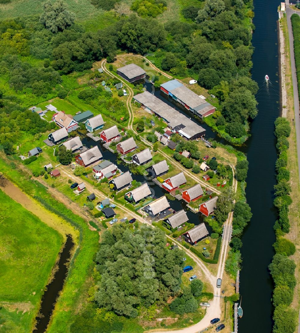 Aerial image Malchin - Boat Houses with gardens on the banks of the Peene - sewer in Malchin in the state Mecklenburg - Western Pomerania