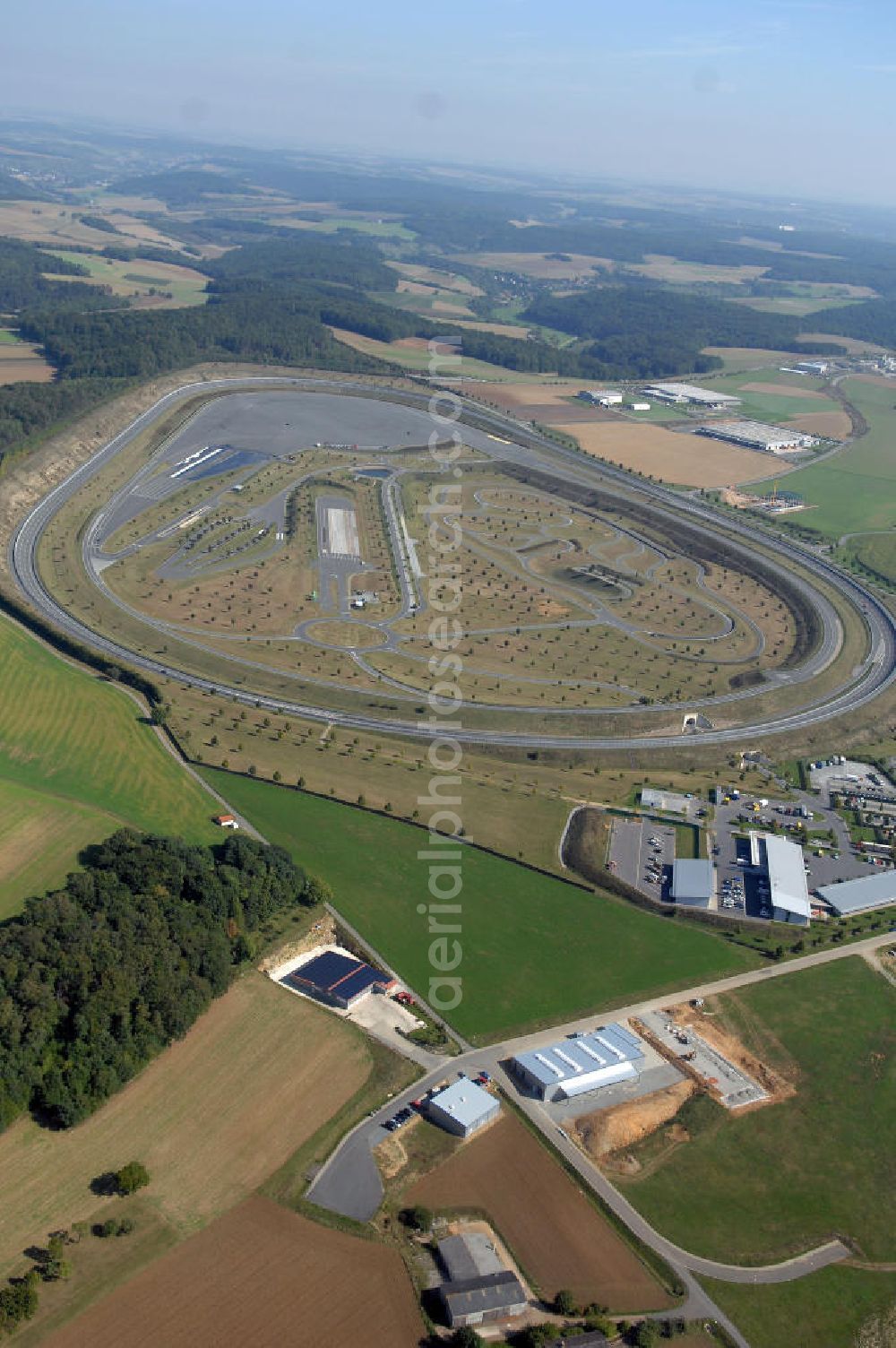 Aerial photograph BOXBERG - Die Robert Bosch GmbH betreibt im Boxberger Ortsteil Windischbuch eine 94 ha große Teststrecke im Gewerbegebiet Seehof. Boxberg ist eine badische Stadt im Main-Tauber-Kreis im Nordosten des Landes Baden-Württemberg. Robert Bosch GmbH Prüfzentrum Boxberg, Robert Bosch Strasse 25 ,97944 Boxberg-Windischbuch Tel.: (07930) 600-210