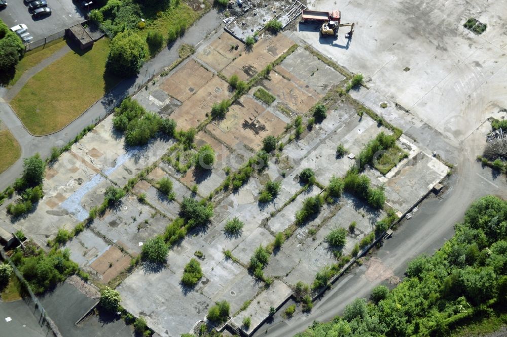 Aerial image Menden (Sauerland) - Industrial wasteland in Menden (Sauerland) in the state North Rhine-Westphalia. The empty, undeveloped site is located amidst industrial and company buildings between Carl-Benz-Strasse and railway tracks in the North of the town centre of Menden