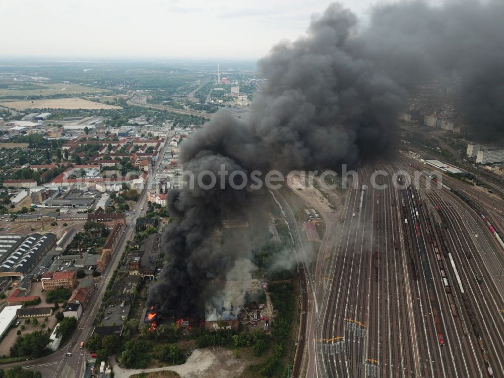 Halle (Saale) from the bird's eye view: Fire Ruin the buildings and halls of the alten Schlachthof on Freiimfelder Strasse in Halle (Saale) in the state Saxony-Anhalt, Germany