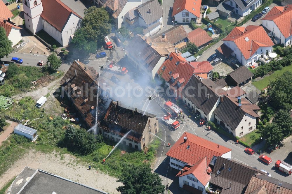 Steinen Höllstein from the bird's eye view: Fire in a residential building in the district Hoellstein of Steinen in the state of Baden-Wuerttemberg. The fire department in the fire fighting operation