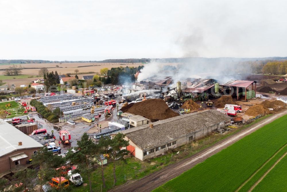 Breesen from above - Smoke and flames during the fire fighting to fire in the peat factory in Breesen in the state Mecklenburg - Western Pomerania, Germany