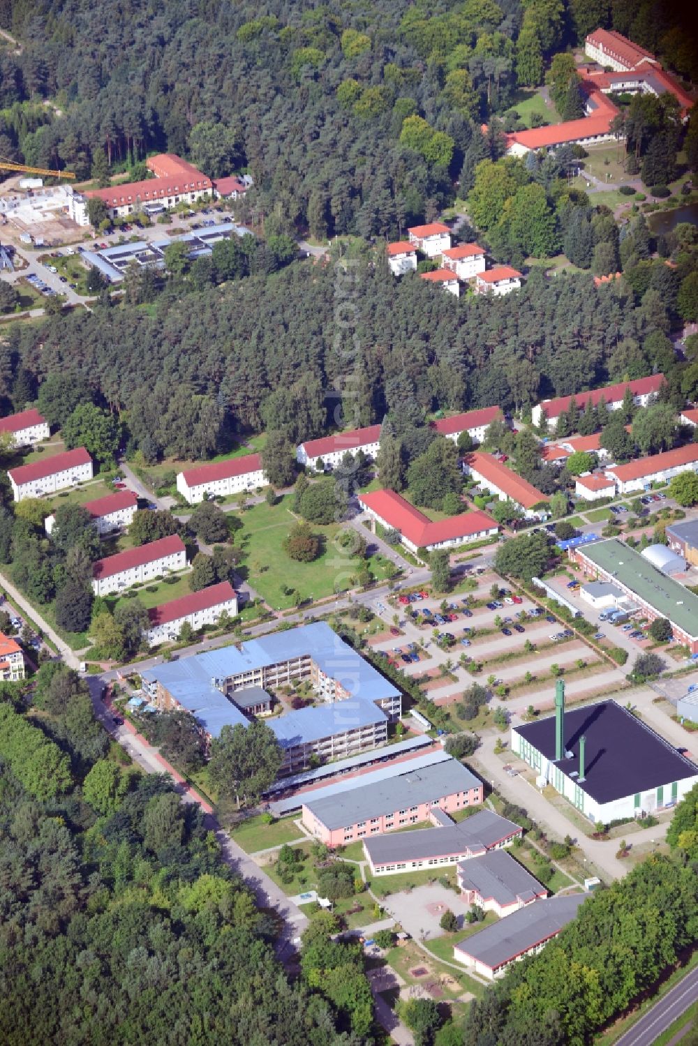 Bernau from the bird's eye view: View the clinic Brandenburg Bernau Waldfrieden on the grounds of the former residential area of the GDR government forest village near Bernau in Brandenburg under the leadership of Michel's Hospital Berlin-Brandenburg. Here to see the heating station, the retirement home Lindenhof and the Robinson School, which all belong to the clinic