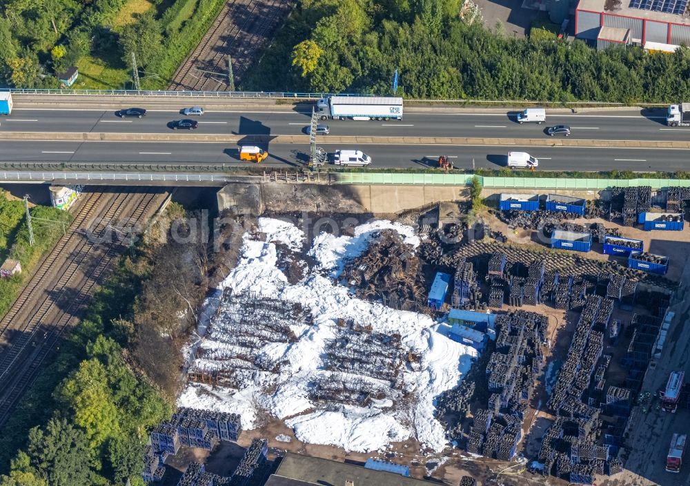 Bochum from the bird's eye view: Destruction and damage pattern of the fire residues on the storage space and parking areas of a car tire store on street Robertstrasse in Bochum at Ruhrgebiet in the state North Rhine-Westphalia, Germany