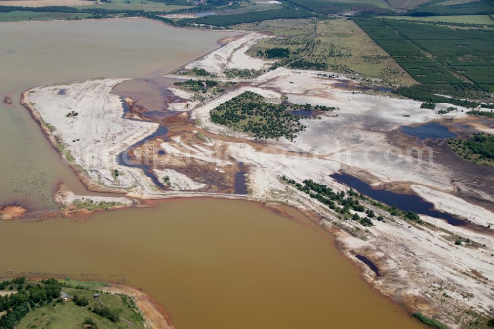 Senftenberg from the bird's eye view: Mining area - terrain and overburden surfaces of coal - opencast mining near Senftenberg in the state Brandenburg