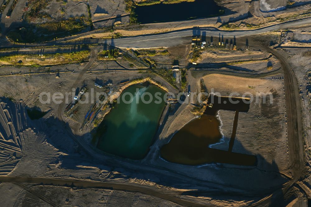 Amsdorf from above - Mining area - terrain and overburden surfaces of coal - opencast mining of ROMONTA Bergwerks Holding AG on Chausseestrasse in Seegebiet Mansfelder Land in the state Saxony-Anhalt, Germany