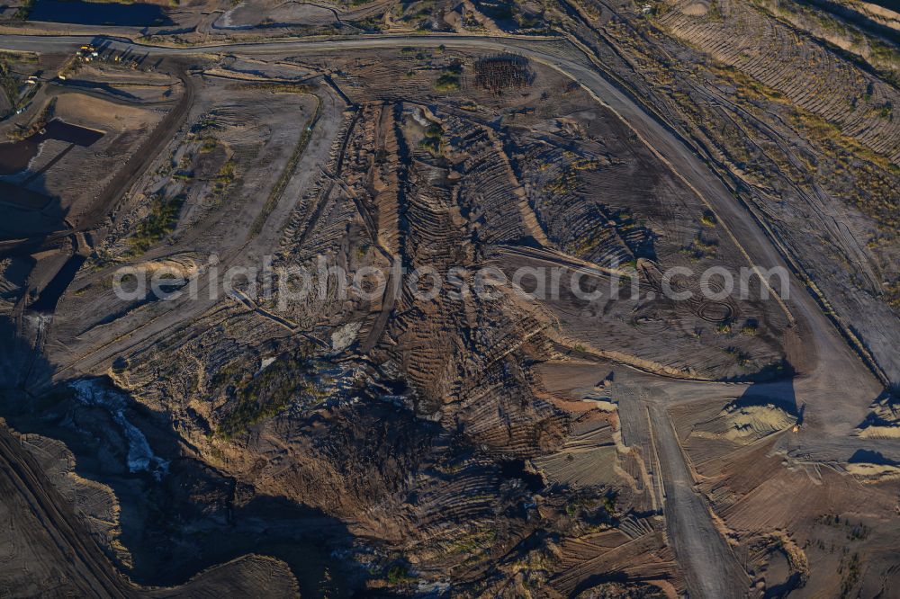 Amsdorf from the bird's eye view: Mining area - terrain and overburden surfaces of coal - opencast mining of ROMONTA Bergwerks Holding AG on Chausseestrasse in Seegebiet Mansfelder Land in the state Saxony-Anhalt, Germany