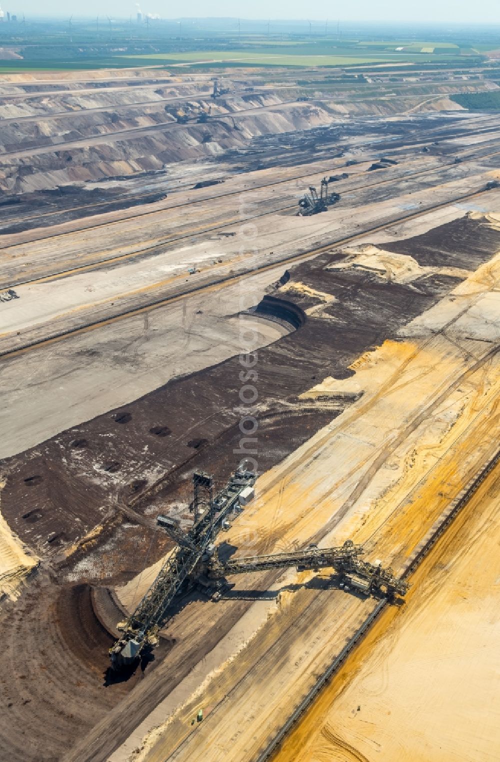 Jüchen from the bird's eye view: Mining area - terrain and overburden surfaces of coal - opencast mining of RWE Power in Juechen in the state North Rhine-Westphalia