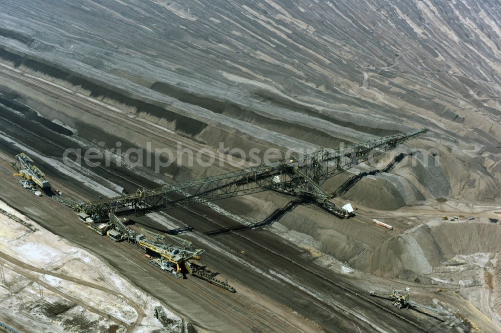 Welzow from the bird's eye view: Mining area - terrain and overburden surfaces of coal - opencast mining of Vattenfall Europe in Welzow in the state Brandenburg