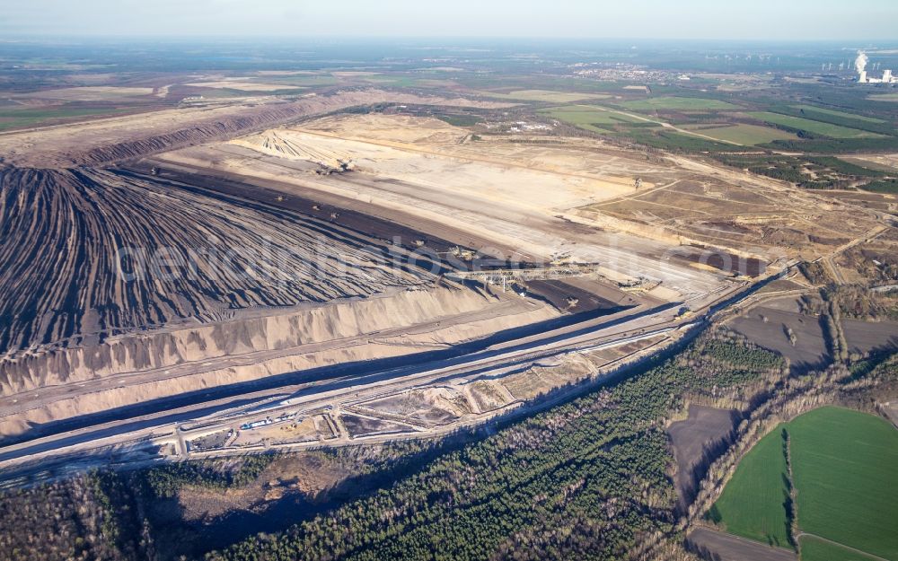 Drebkau from the bird's eye view: Mining area - terrain and overburden surfaces of coal - opencast mining of Vattenfall Europe in Welzow in the state Brandenburg