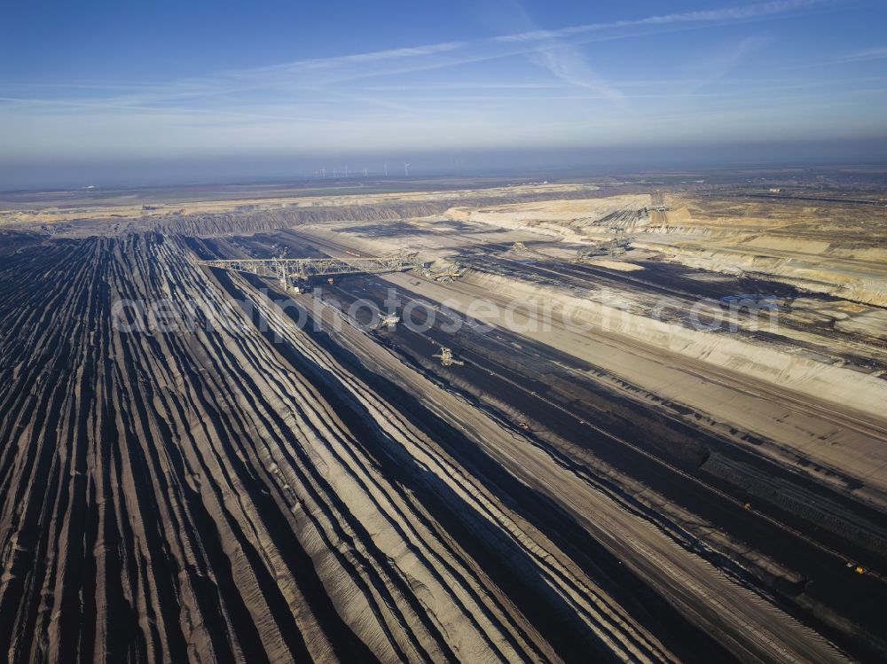 Welzow from the bird's eye view: Mining area - terrain and overburden surfaces of coal - opencast mining of Vattenfall Europe in Welzow in the state Brandenburg