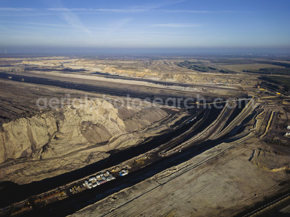 Welzow from the bird's eye view: Mining area - terrain and overburden surfaces of coal - opencast mining of Vattenfall Europe in Welzow in the state Brandenburg