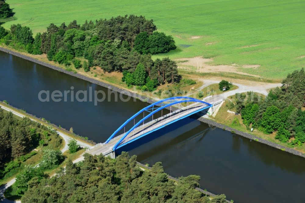 Aerial image Burg (bei Magdeburg) - Bridge over the Elbe-Havel-Kanal in the West of the town of Burg (bei Magdeburg) in the state of Saxony-Anhalt. The distinct blue arc bridge spans the canal in the West of the town. The bridge is surrounded by forest and is one of several bridges on the canal