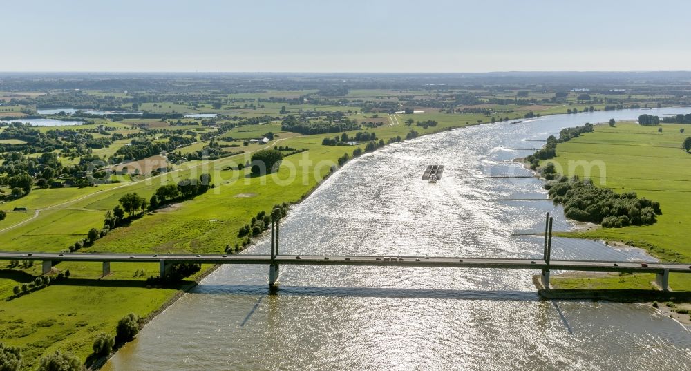 Rees from the bird's eye view: Countryside view on the bridge Rheinbrücke Rees-Kalkar, which is spanned in the state of North Rhine-Westphalia on the Lower Rhine, and forms a part of the federal highway 67. The building project is a cable-stayed bridge