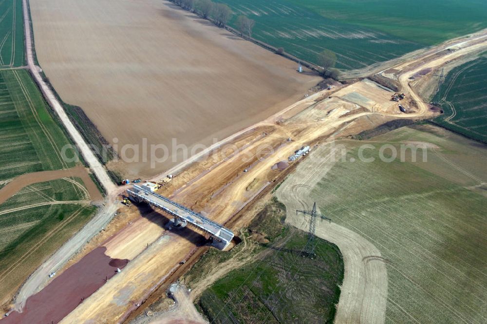 Aerial photograph Hötzelsroda - Blick auf die Baustelle der Strassenbrücke zwischen Hötzelsroda und Bolleroda welche über die A4 führt und einer Unterführung westlich von Hötzelsroda. Der Neubau ist Teil des Projekt Nordverlegung / Umfahrung Hörselberge der Autobahn E40 / A4 in Thüringen bei Eisenach. Durchgeführt werden die im Zuge dieses Projektes notwendigen Arbeiten unter an derem von den Mitarbeitern der Niederlassung Weimar der EUROVIA Verkehrsbau Union sowie der Niederlassungen Abbruch und Erdbau, Betonstraßenbau, Ingenieurbau und TECO Schallschutz der EUROVIA Beton sowie der DEGES.