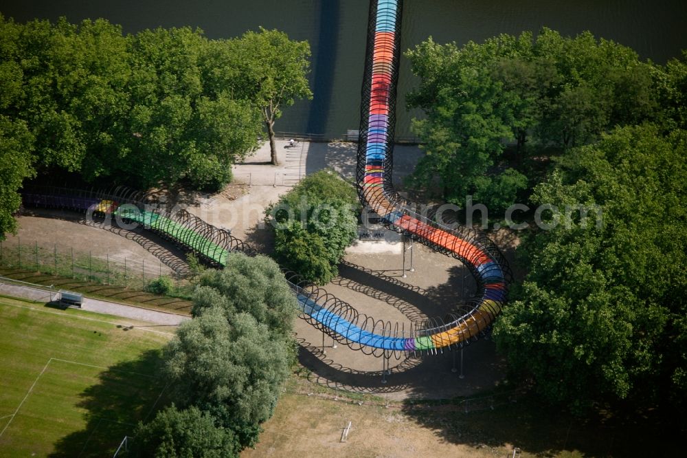 Oberhausen from above - View of the bridge Slinky Springs to Fame in Oberhausen in North Rhine-Westphalia. The bridge sculpture with spiral over the Rhine-Herne-Kanal was conceived within the framework of the art project Emscherkunst.2010 by the sculptor Tobias Rehberger in collaboration with the engineering firm Schlaich, Bergemann and Partner and opened in 2011. The pedestrian and bicycle bridge connects the garden of the castle with the Emscherinsel