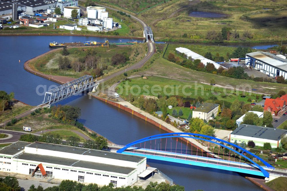 Genthin from the bird's eye view: Blick auf die Friedensbrücke / Brücke des Friedens B16 (v) und die Eisenbahnbrücke Genthin-Jerichow B15 (m) über den Elbe-Havel-Kanal, sowie die Eisenbahnbrücke Roßdorfer Altkanal B26 (h) in Sachsen-Anhalt. Ein Projekt des WSV, Wasser- und Schifffahrtsverwaltung des Bundes. Bridges over the Elbe-Havel-Canal and the Railway brige over the Rossdorfer Old Canal in Saxony-Anhalt.