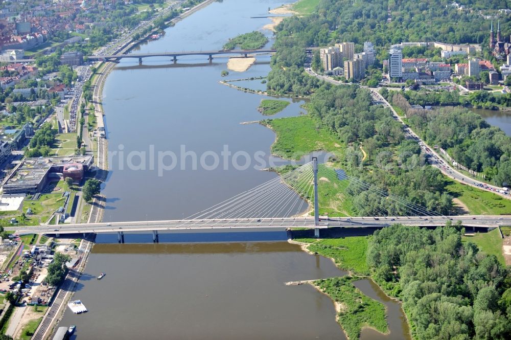 Warschau / Warszawa from the bird's eye view: The cable-stayed bridge with names Swietokrzyski bridge or Holy Cross Bridge and the Slasko-Dabrowski-Bridge leading over the Vistula River in Warsaw in the Voivodeship Masovian in Poland