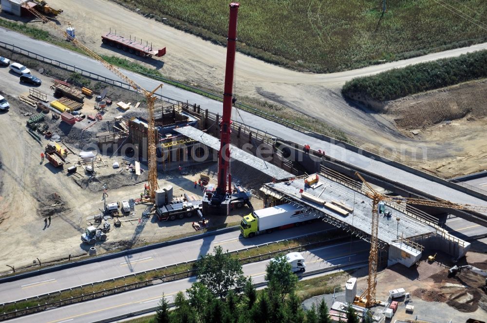 Aerial photograph Dittersdorf - Buildings and route of the motorway A9 motorway with four lanes now. Currently, reconstruction, expansion and new construction work is underway for the six-lane expansion of Highway 9 between Triptis and Schleiz by Wayss & Freytag Ingenieurbau and EUROVIA VINCI