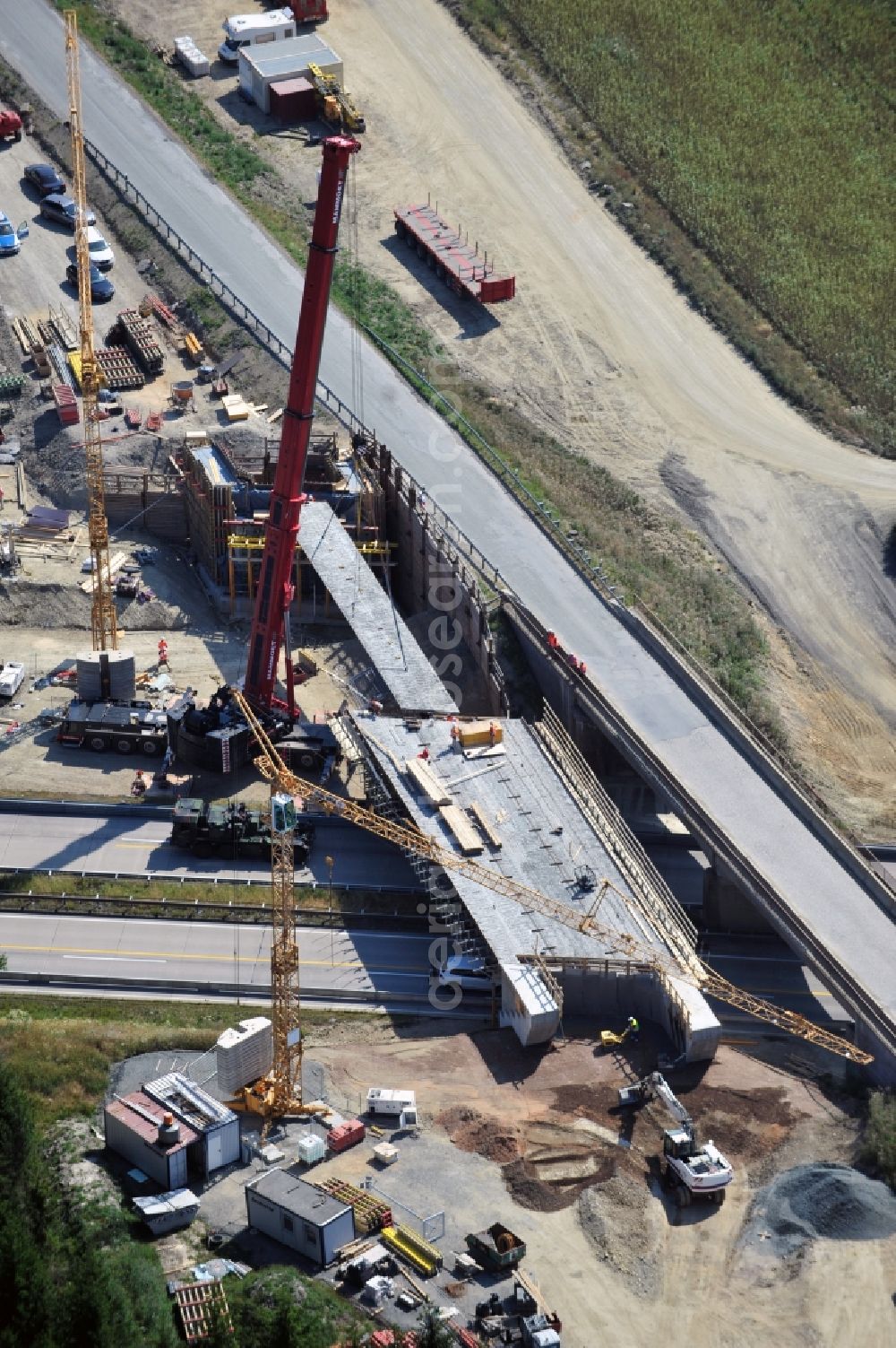 Dittersdorf from above - Buildings and route of the motorway A9 motorway with four lanes now. Currently, reconstruction, expansion and new construction work is underway for the six-lane expansion of Highway 9 between Triptis and Schleiz by Wayss & Freytag Ingenieurbau and EUROVIA VINCI