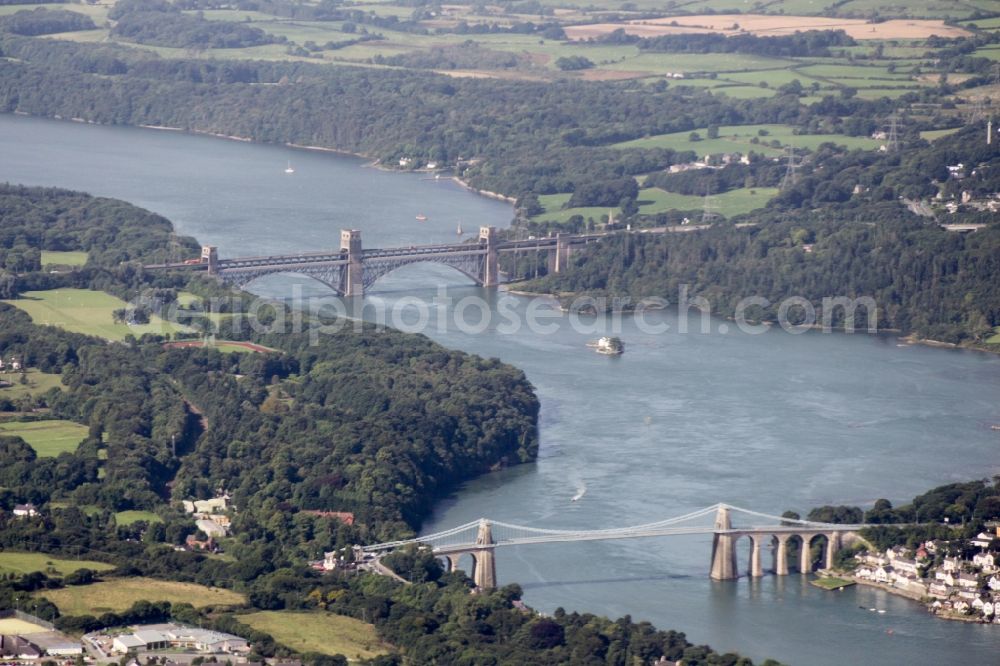 Aerial image Bangor - Bridges along the Menai Strait in Bangor in Wales, United Kingdom. Forward the Menai bridge, behind the reinforced Bridge - Road Bridge Pont Britannia along the N Wales Expressway A55