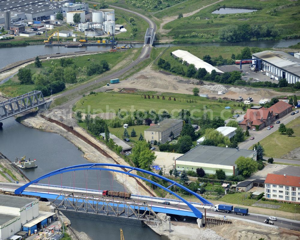 Aerial photograph Genthin - Blick auf die Eisenbahnbrücke Genthin-Jerichow B15, die Friedensbrücke / Brücke des Friedens B16 und die Eisenbahnbrücke Roßdorfer Altkanal B26. Die Brücken überführen den Elbe-Havel-Kanal bei km 364,021 (B15) und bei km 364,229 (B16), sowie den Roßdorfer Altkanal / RAK bei km 0,360 (B26). Ein Projekt des WSV: Wasserstraßen-Neubauamt Magdeburg, 39106 Magdeburg, Tel. +49(0)391 535-0, email: wna-magdeburg@wsv.bund.de Peace Bridge Friedensbruecke and the Railroad bridge over the Elbe-Havel-Canal and the Railway brige over the Rossdorfer Old Canal.