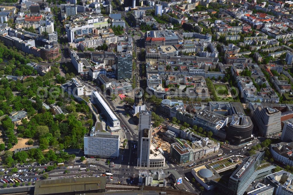 Aerial image Berlin - The Breitscheidplatz in the Charlottenburg district of Berlin, next to the zoo is a popular tourist center at the City West. Here is with the Kaiser Wilhlem Memorial Church is one of the major landmarks of the capital. Shopping centers such as the renovated bikini house the Europe Center and department stores and a variety of shops attract many visitors. With the high-rise Zoofenster the city has experienced a new dominant. Here this luxury hotel Waldorf Astoria guests. At the intersection of Kant road - Joachimstalerstrasse-road are the shopping centers Neues Kranzler Eck and the Ku-Damm corner. The train station Zoologischer Garten S-Bahn and regional station of the City West