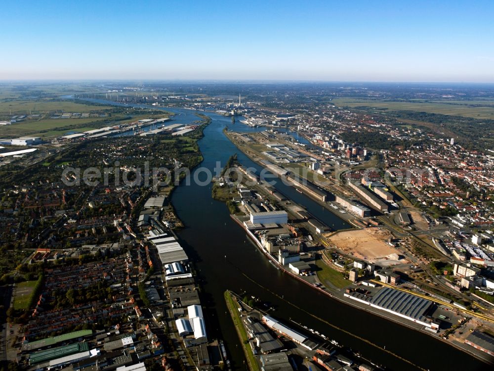 Bremen from the bird's eye view: Port of Bremen on the river Weser in the Hanseatic City of Bremen. View from the South over the are of the port on the Weser riverbanks. The harbour is part of the commercial ports of Bremerhaven and Bremen and is therefore part of the second largest German and fourth largest European universal ports. The compound consists of several pools, factories and wharfs