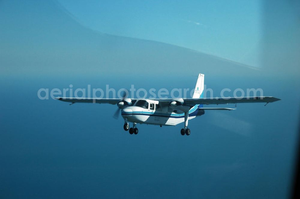 Aerial image Mosambik / Mozambique - Eine als Buschflieger genutzte Britten-Norman BN-2 Islan der über dem Küstenbereich vor Mosambik Lumbo. A bush plane used as a Britten-Norman BN-2 Islan der on the coastal area in front Lumbo Mozambique.