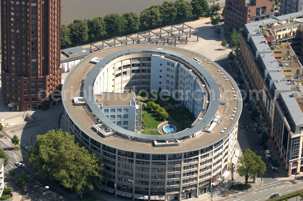 Aerial image Frankfurt am Main - Blick auf das Büro- und Geschäftshaus Colosseum am Walter- von Cronberg-Platz -gegenüber des Hochhauses Main Plaza im Stadtteil Sachsenhausen. View of the office and commercial Colosseum at the Walter-von-Cronberg Platz - in the suburb of Sachsenhausen.