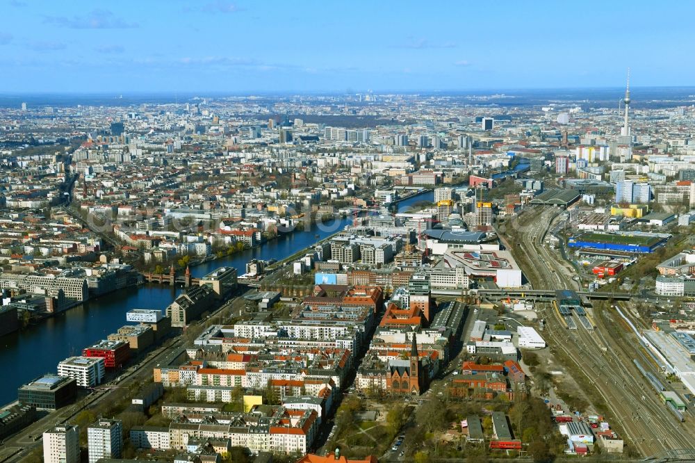 Berlin from the bird's eye view: Construction site on building of the monument protected former Osram respectively Narva company premises Oberbaum City in the district Friedrichshain in Berlin. Here, among many other companies, BASF Services Europe, the German Post Customer Service Center GmbH and Heineken Germany GmbH are located. It is owned by HVB Immobilien AG, which is part of the UniCredit Group