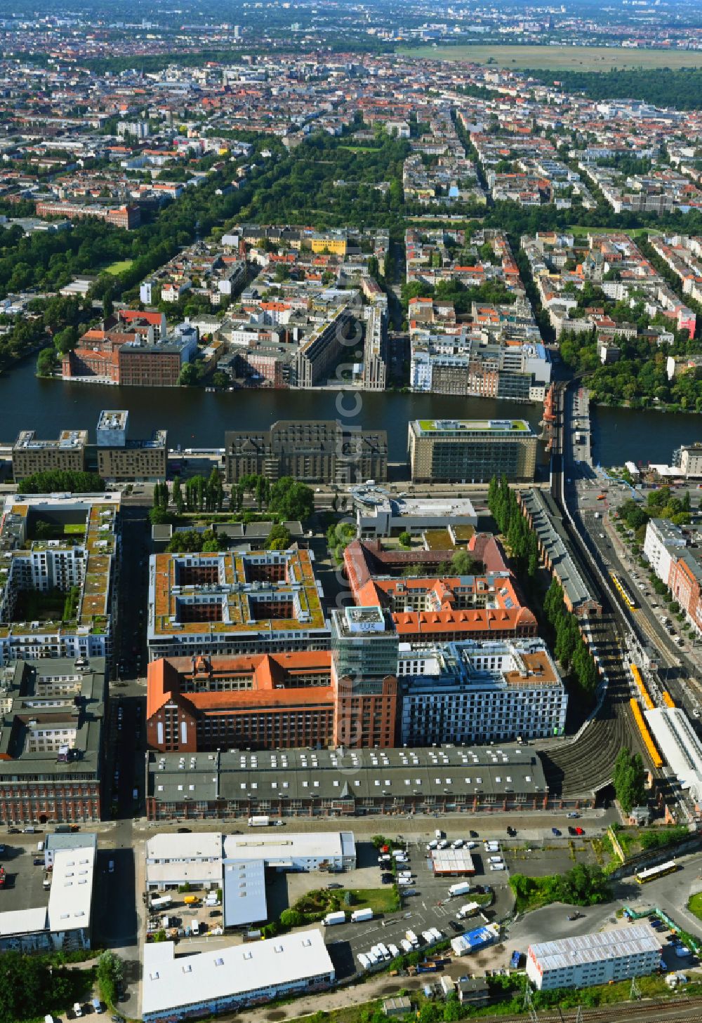 Aerial image Berlin - Construction site on building of the monument protected former Osram respectively Narva company premises Oberbaum City in the district Friedrichshain in Berlin. Here, among many other companies, BASF Services Europe, the German Post Customer Service Center GmbH and Heineken Germany GmbH are located