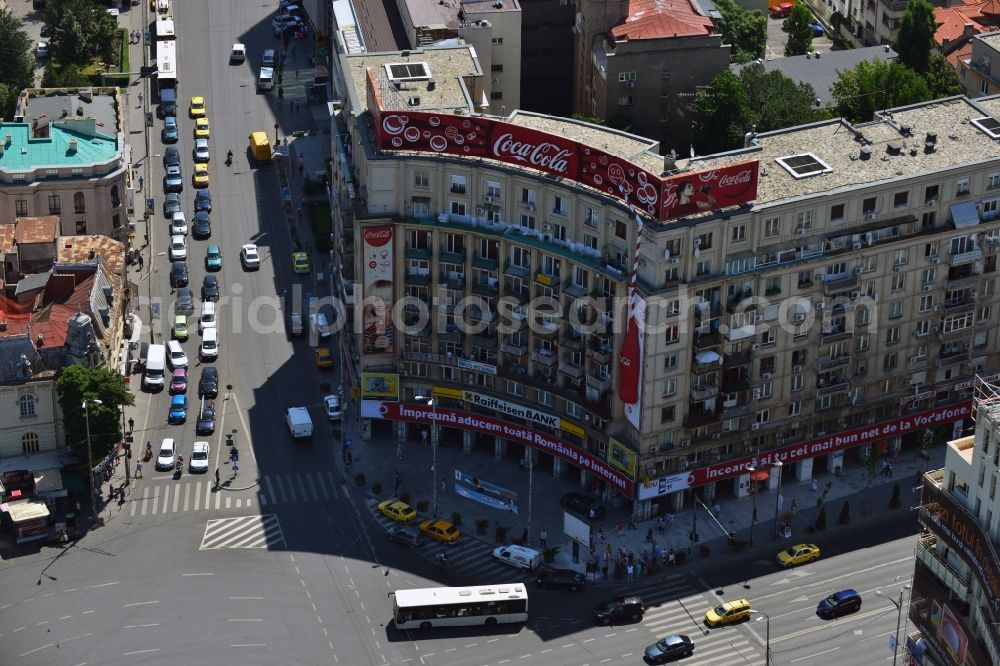 Aerial image Bukarest - Office building on the square Piata Romana in Sector 1 in the city center of Bucharest in Romania. The building is characterised by the distinct Coca-Cola advertisement on its roof. The square is one of the major traffic intersections of the city