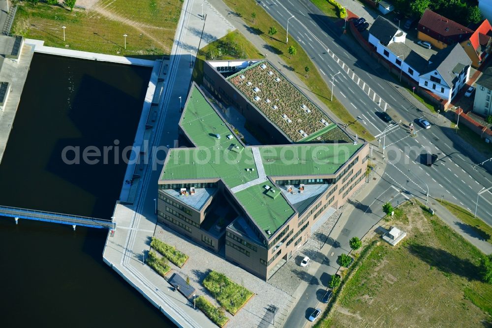 Aerial image Rostock - Construction site to build a new office and commercial building of Centogene AG Am Strande on Holzhalbinsel in Rostock in the state Mecklenburg - Western Pomerania, Germany