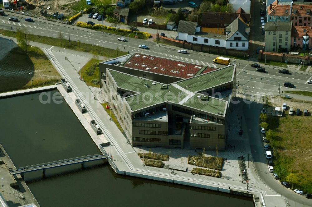 Aerial image Rostock - Construction site to build a new office and commercial building of Centogene AG Am Strande on Holzhalbinsel in Rostock in the state Mecklenburg - Western Pomerania, Germany