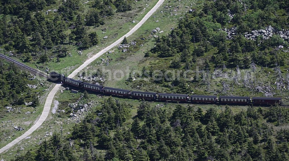 Brocken from above - The railway Brockenbahn with a Mallet-Engine / steam locomotive / railcar, a narrow-gauge railway, during a trip at the Brocken mountain in Saxony-Anhalt