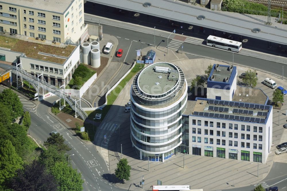 Aerial image Unna - Office building on Bahnhofstrasse in the North of Unna in the state of North Rhine-Westphalia. The distinct building with ovale shape and glass facade includes the job center of the county district of Unna