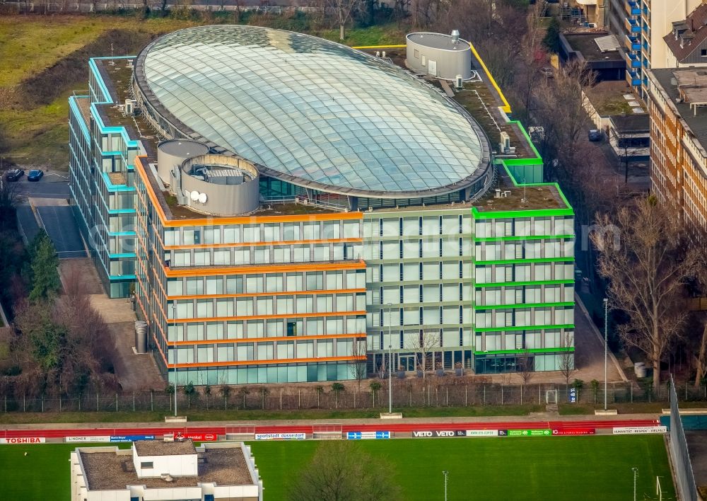 Düsseldorf from the bird's eye view: Office building of Deloitte Germany in Duesseldorf in the state of North Rhine-Westphalia. The building with the colourful facade and the glass roof is located on the edge of the sports centre North