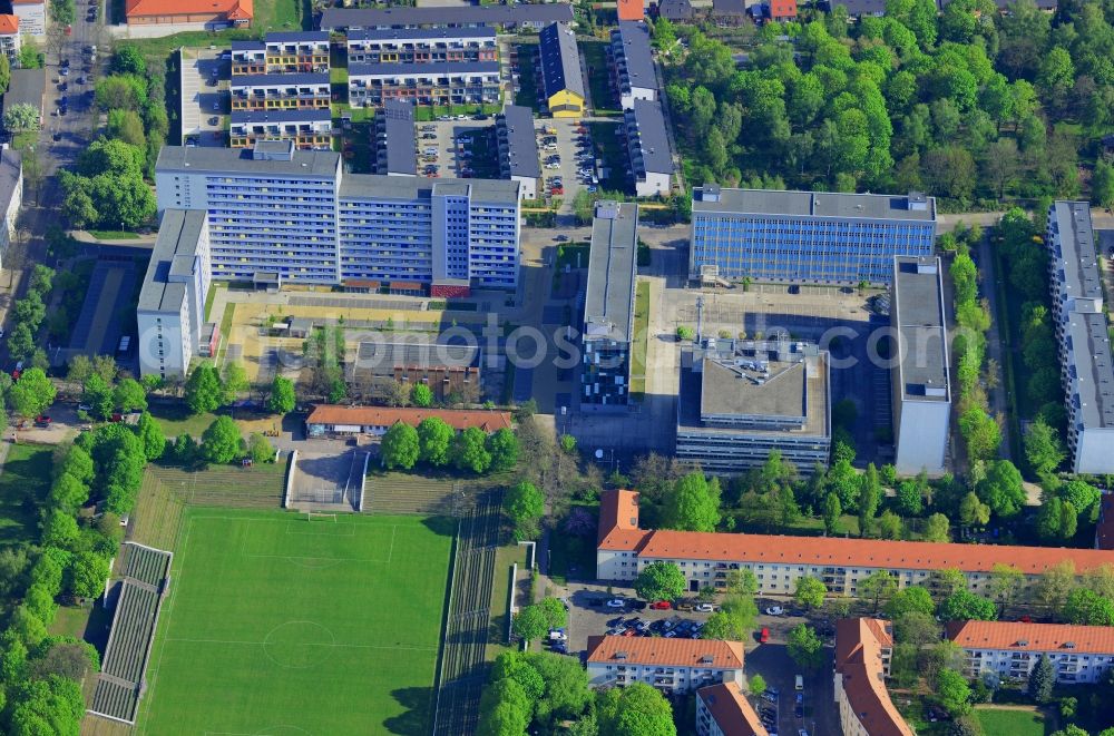 Berlin from above - Job centre, football pitch and office buildings on Gotlindestrasse in the district of Lichtenberg in Berlin in Germany. The buildings are located amidst a residential area consisting of estates and multi-family homes. The job agency is located in the middle, next to the football pitch and arena of SV Lichtenberg 47