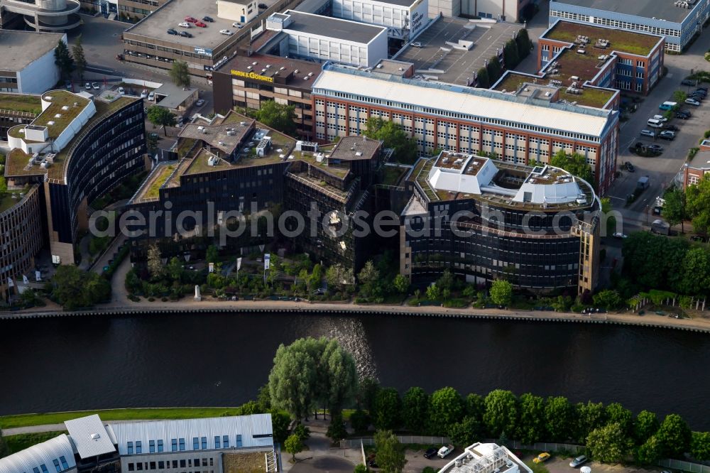 Berlin from above - Office building of the administrative and business center of Skandia Insurance Management & Service GmbH at the riverside in Berlin