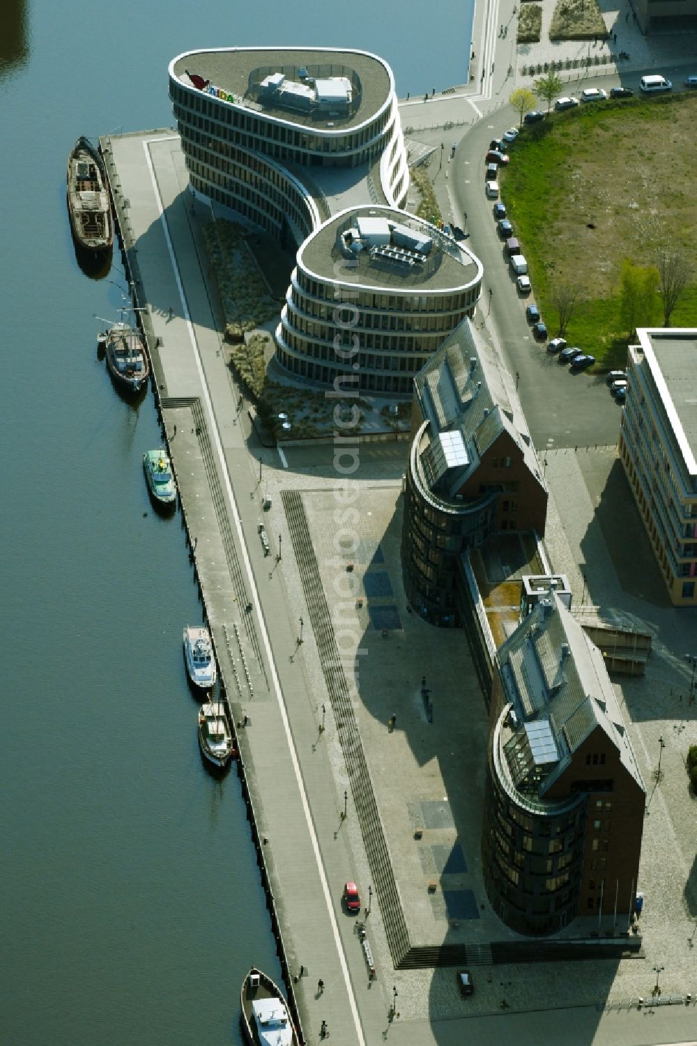 Rostock from the bird's eye view: Office buildings of the Business Center Stadthafen and Aida Home der AIDA Cruises - German Branch of Costa Crociere S.p.A. in Rostock in the state Mecklenburg-Western Pomerania, Germany