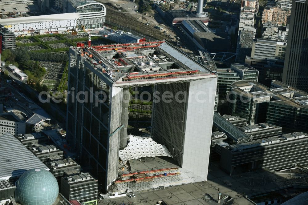 Paris from the bird's eye view: Office building Grande Arche in the business quarter of highrise buildings La Défense in Paris in Ile-de-France, France. It is home to the ministry of commerce and traffic, to offices and the human rights association